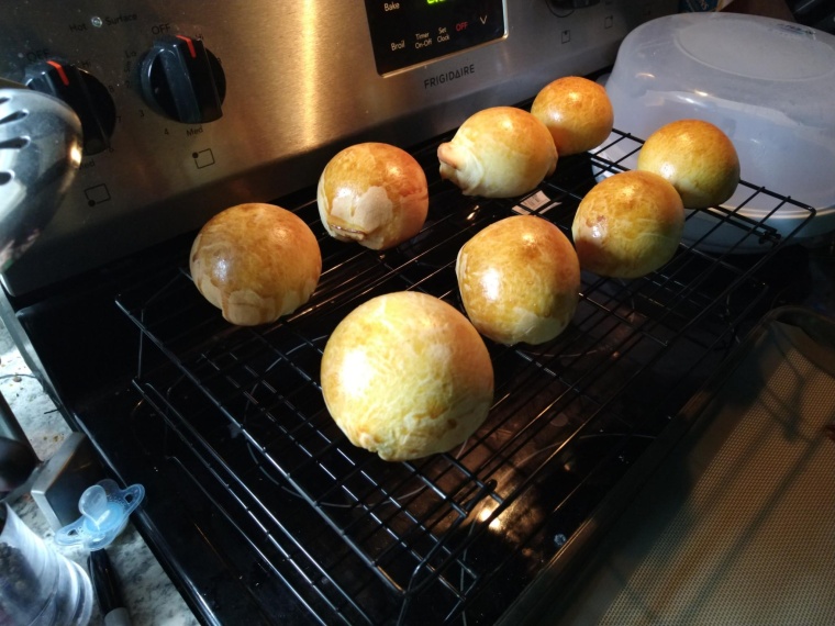 Eight buns on a cooling rack